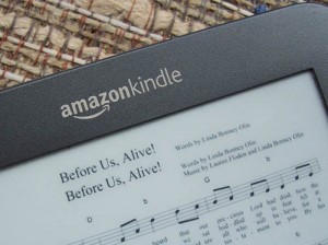 Photo of a Kindle screen displaying sheet music with a double image of the song title