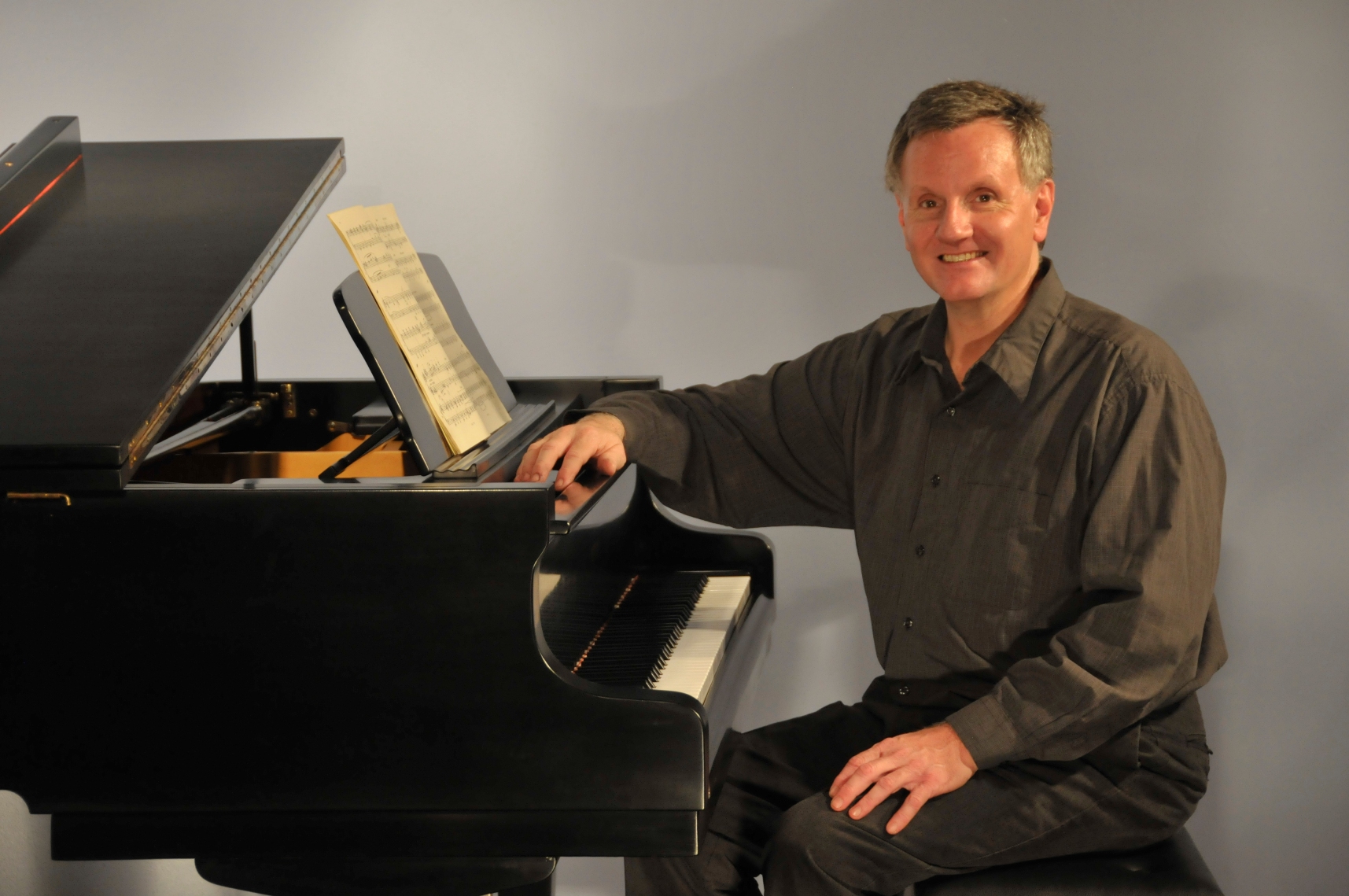 Portrait of Andrew Remillard at the piano